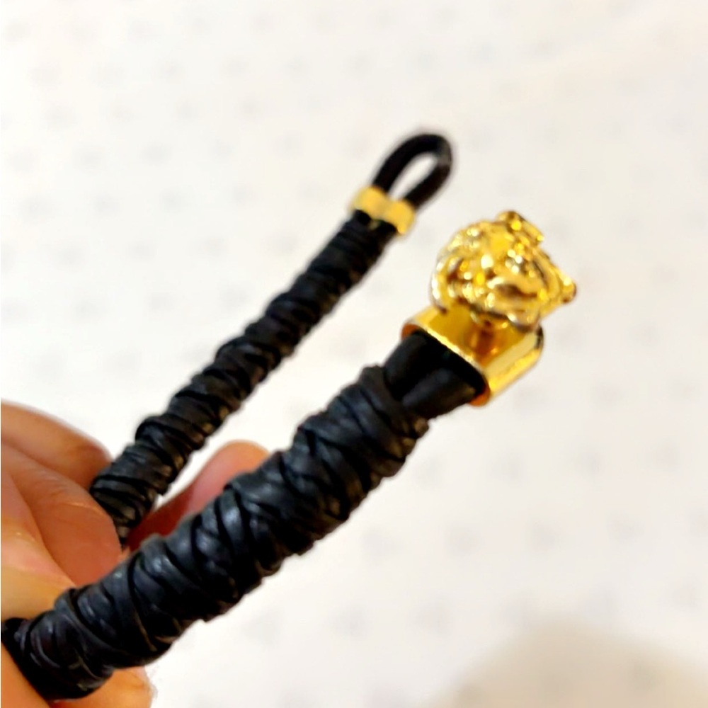 Elegant Black Braided Bracelet with Gold Lion Clasp